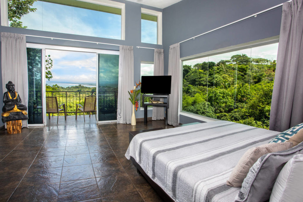 This room has the ultimate view of rainforest and ocean, the outdoors is truly brought indoors.