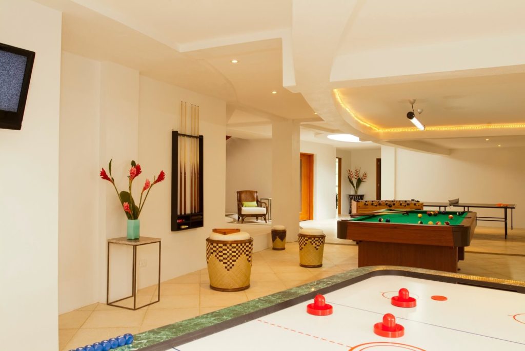 This brilliant games room is a great addition to the villa, with ping pong, pool table, and air hockey!