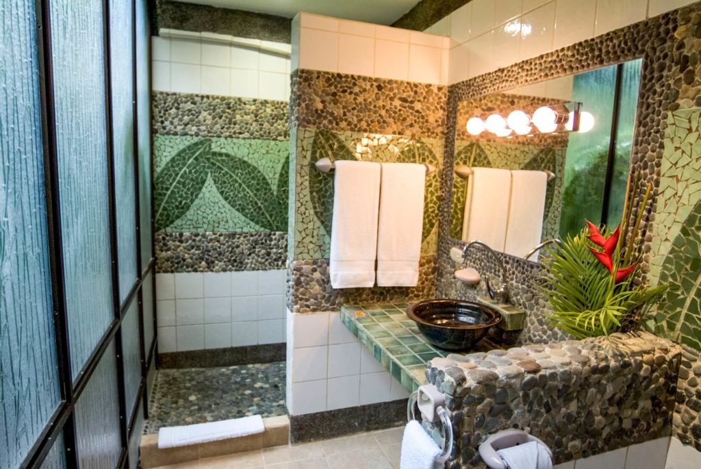The detailed stone and tile work in the bathrooms, hand-laid by local artists, is a unique feature of the villa.