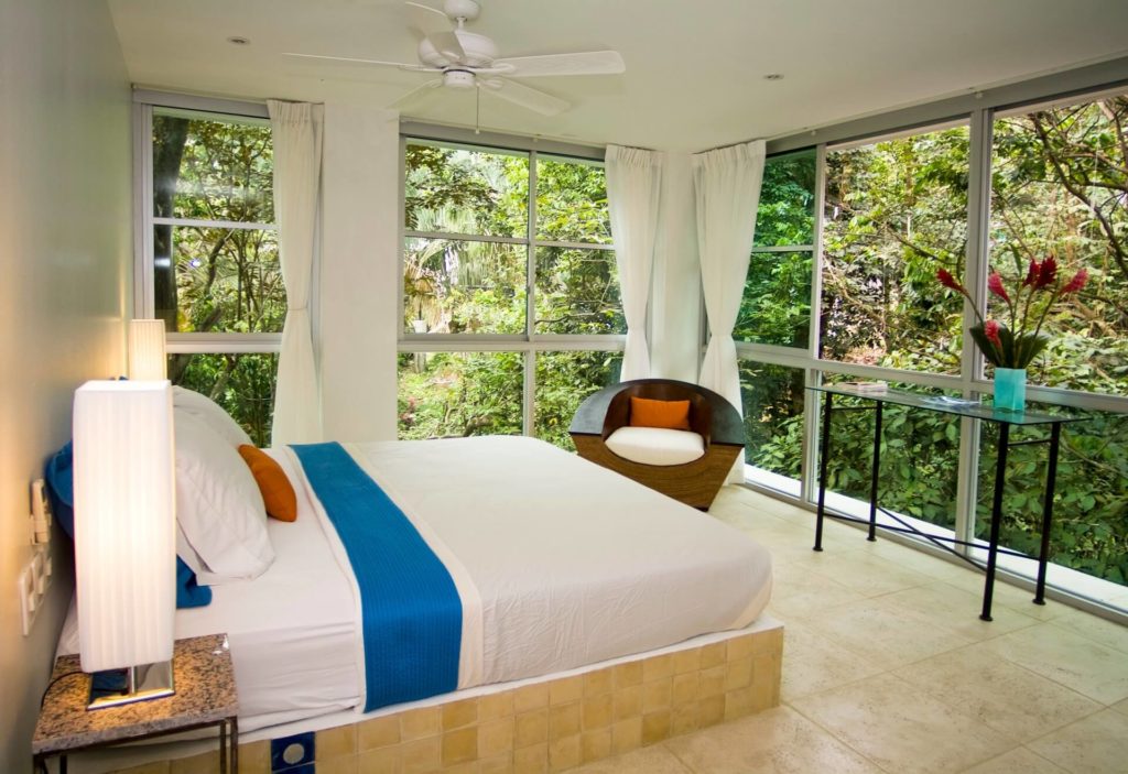 The jungle view wraps around this whole bedroom for a complete rainforest immersive experience.