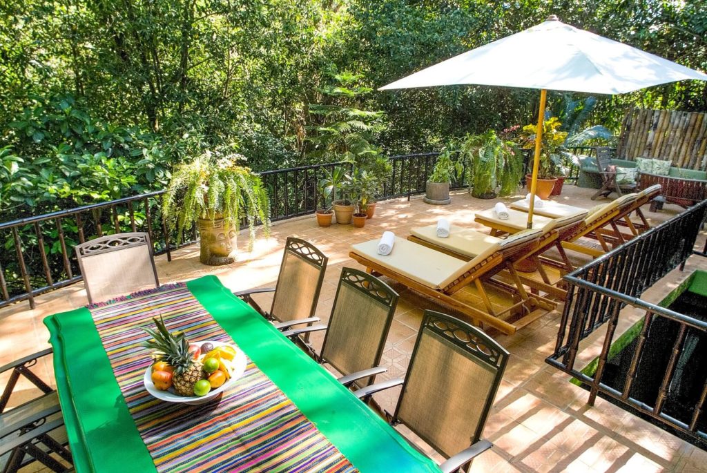 The amazing terrace has areas for sunbathing and dining with a great jungle and pool view.