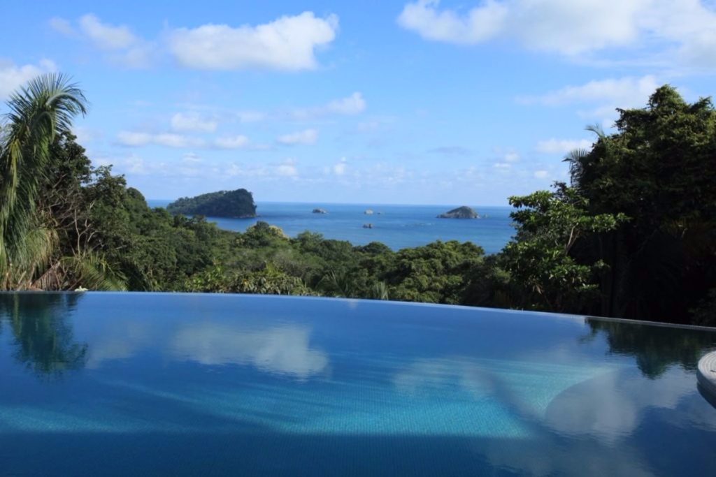The incredibly-large infinity pool seems to stretch all the way to the ocean.