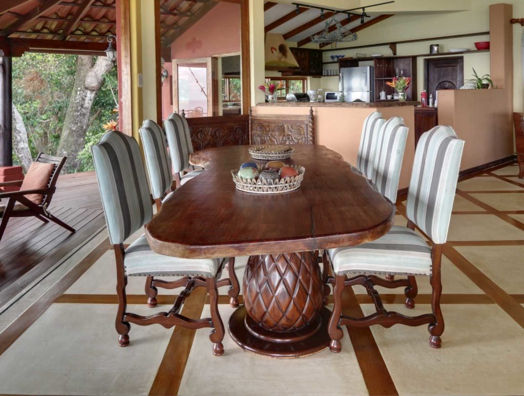 Enjoy a family feast at the carved rustic dining table which is large enough to seat eight.