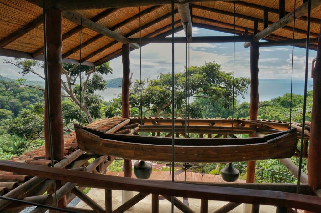 Hanging from the rafters is this custom-built wooden canoe, a clever addition to the design of this villa.