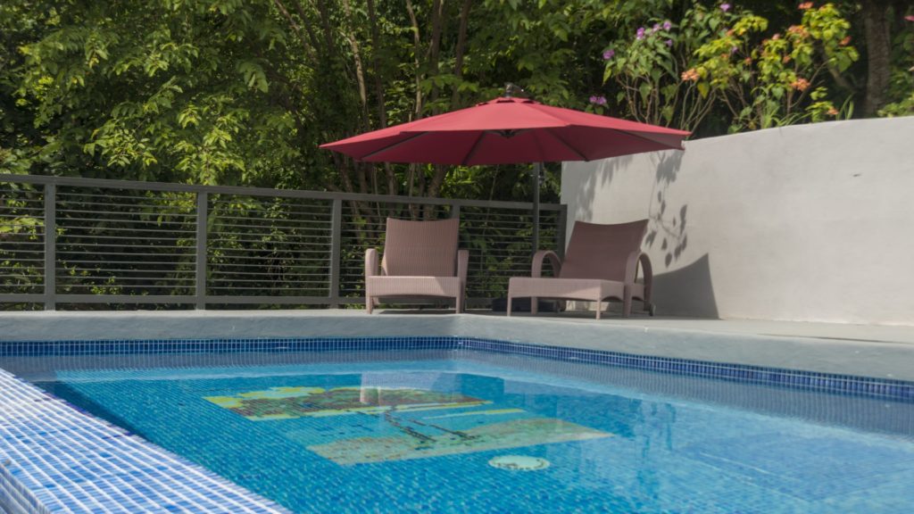 The beautiful tiled pool has deck seating with awesome views.
