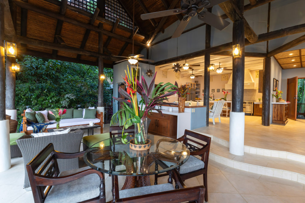 This villa features an ample lounge and living space with ocean breezes and ceiling fans.
