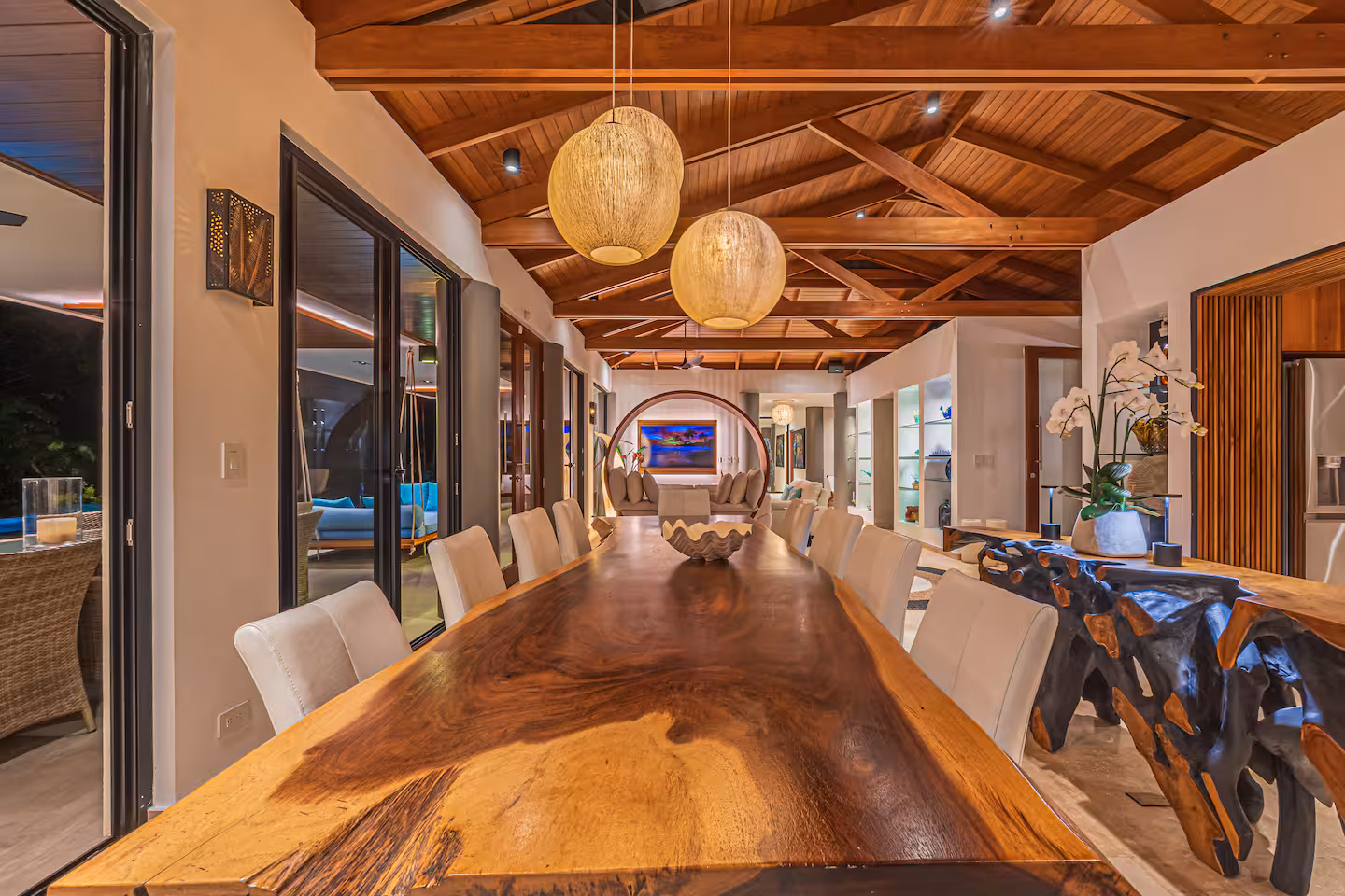 Handcrafted wood dining table in an open-plan living and dining area near Dominical, Costa Rica.