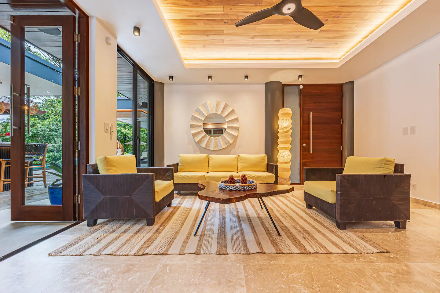 Modern living room with open layout and jungle views in a villa near Dominical, Costa Rica.