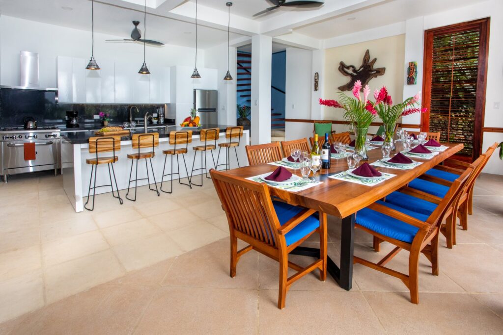 Designed for gathering, this open-concept dining space connects effortlessly with the villa’s modern chef’s kitchen.