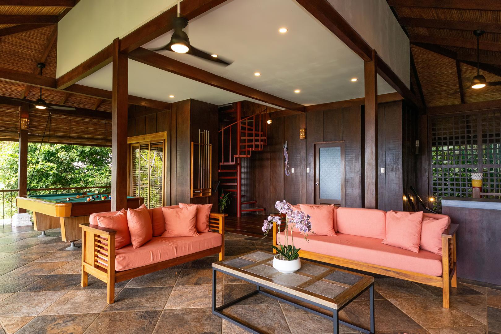 Open-air lounge and game room with pool table in a luxury Manuel Antonio villa