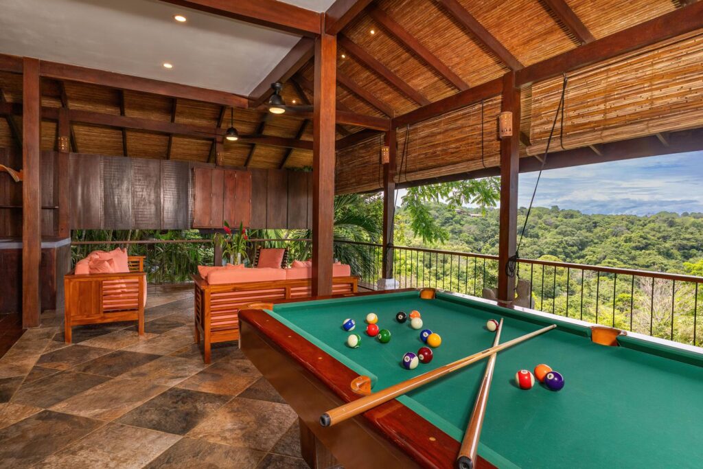 An open-air entertainment space where tropical architecture, jungle views, and relaxed gatherings come together.
