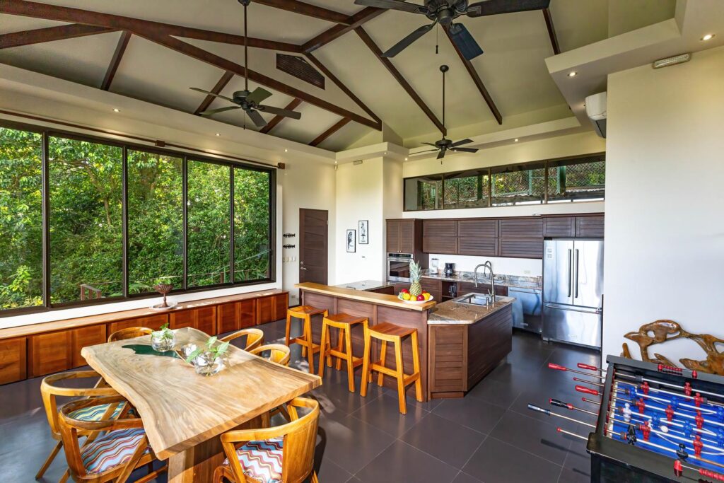 The Sky Suite has a spacious open-concept kitchen and dining area framed by jungle views, designed for shared meals, easy conversation, and relaxed moments that unfold naturally throughout the day.