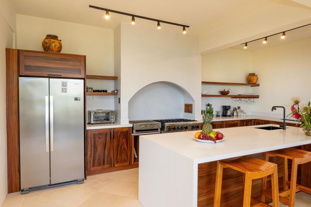 A beautifully appointed kitchen designed for effortless cooking and gathering, where custom wood cabinetry and clean lines create a calm, functional heart of the home.