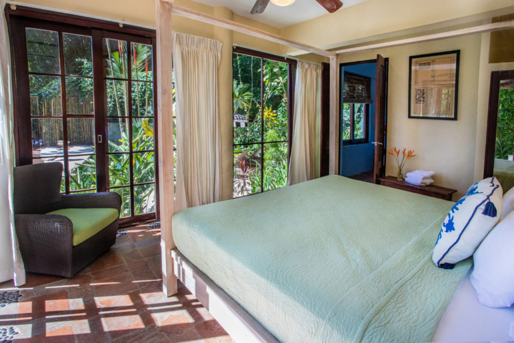 Each of the four bedrooms in the main house has a king bed and private bathroom in this stunning vacation home.