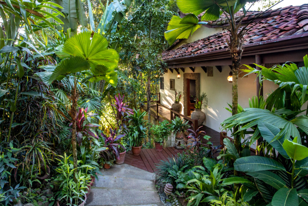 Lush tropical gardens surround this beautiful vacation home.