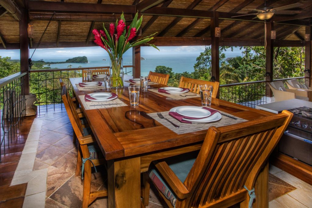 The gorgeous native wood dining table overlooks the whole living area and shares stunning rainforest and ocean views.