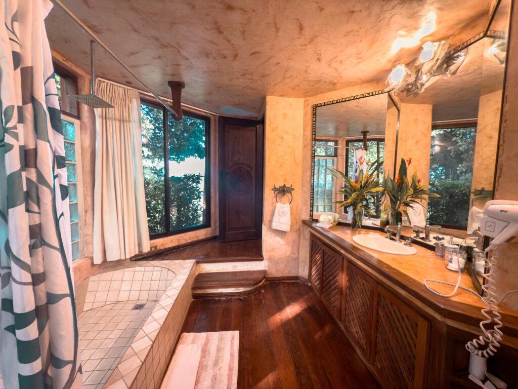Soak in a bathtub framed by lush gardens.
