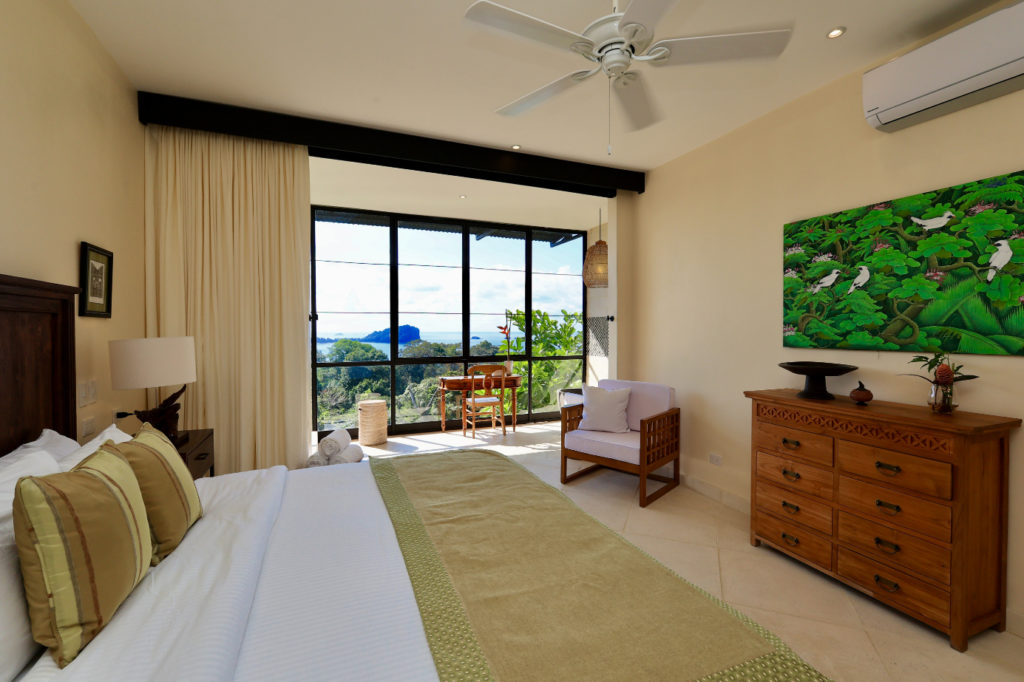 Bedroom with exquisitely crafted furnishings in a fantastical setting with exclusive vistas of Manuel Antonio.