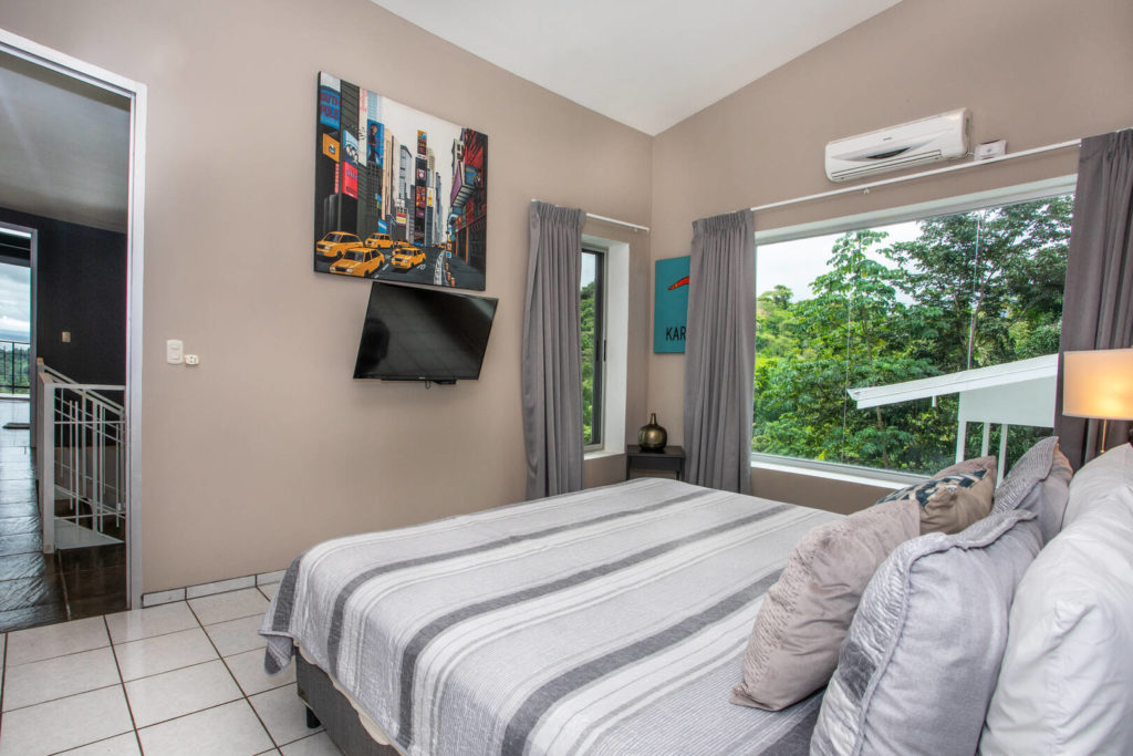 Every bedroom has air conditioning and features a TV and interesting artwork.