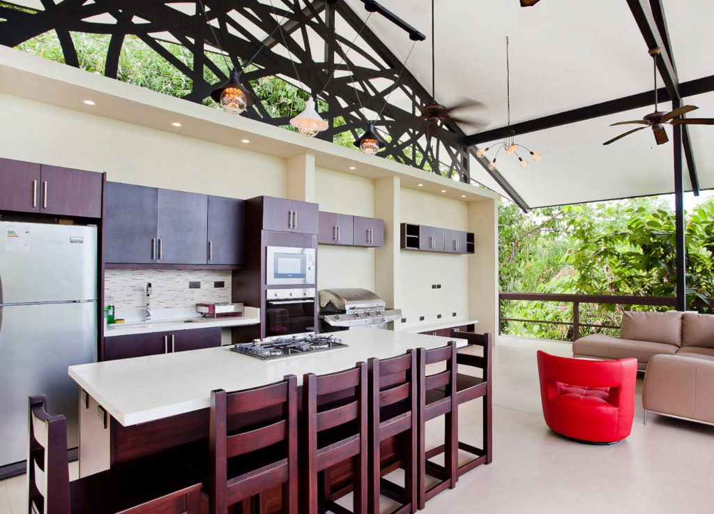 This open-air kitchen, living, and dining area is located on the roof of the casita.