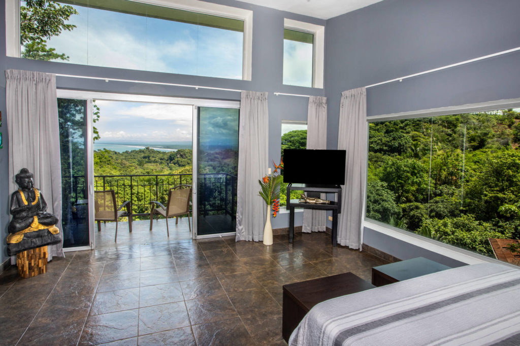 Enjoy some breathtaking views while relaxing on your bed after a day of fun-filled beach time.