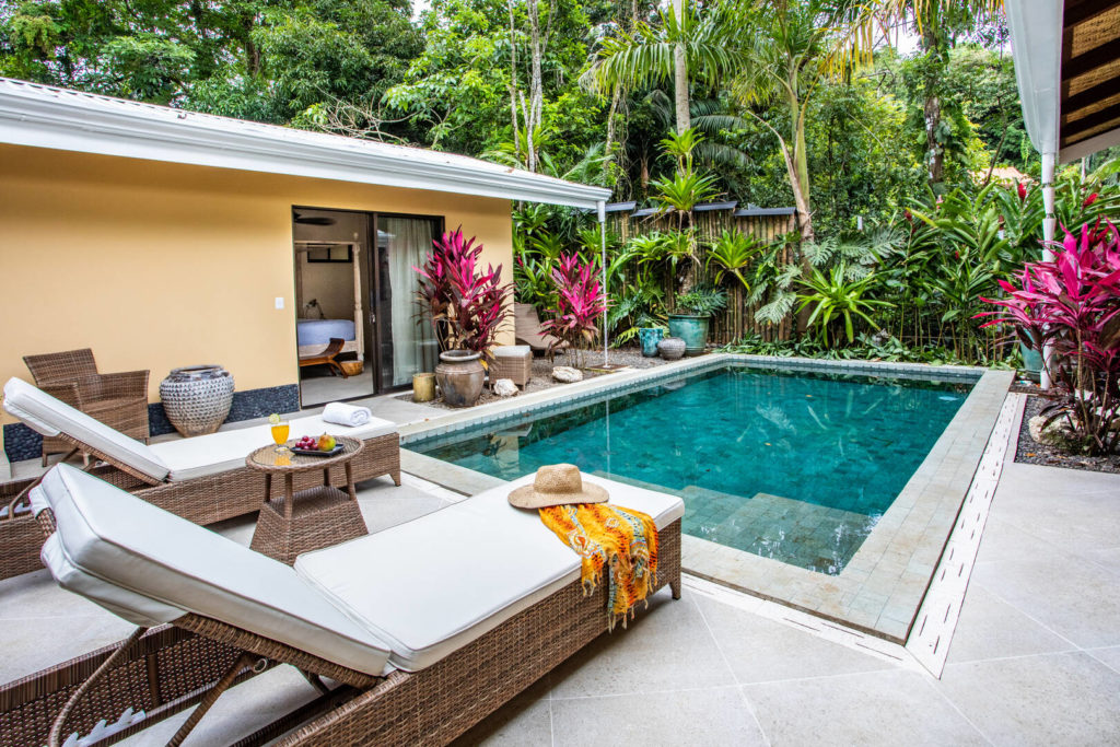 The incredible private pool is embraced by the villa on three sides and the lush rainforest at the end.