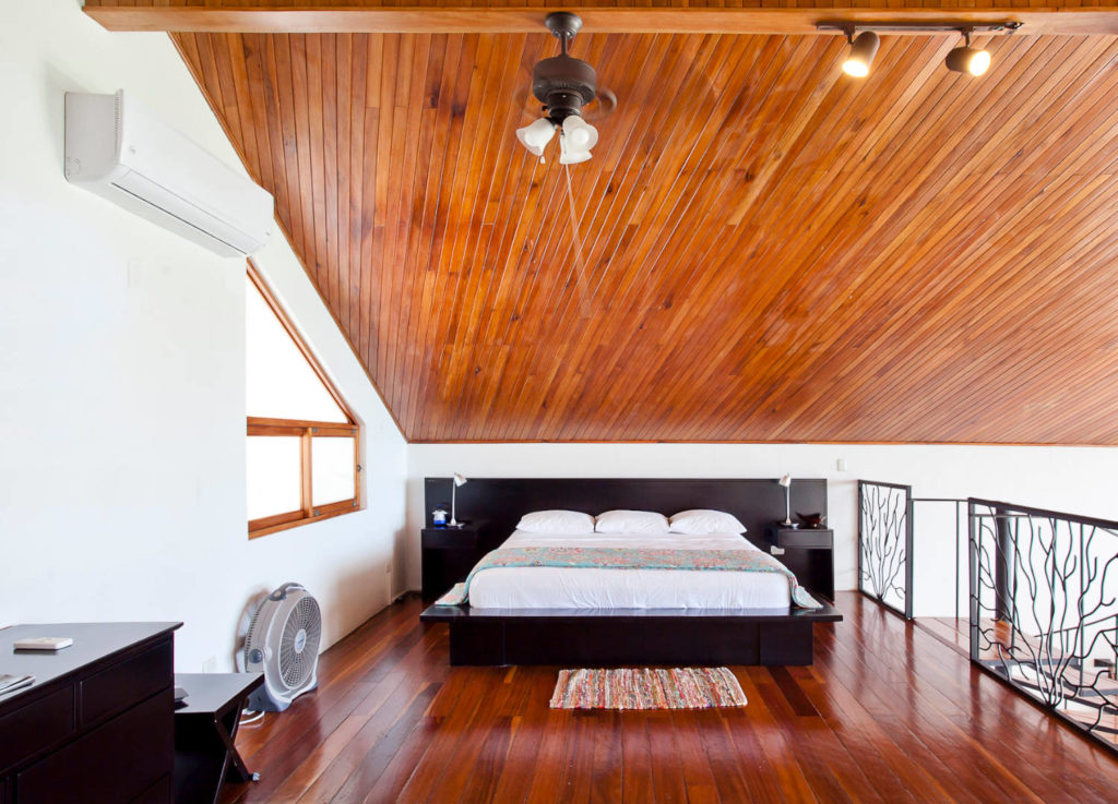 The amazing loft king bedroom is accessed by a winding staircase from the living room.