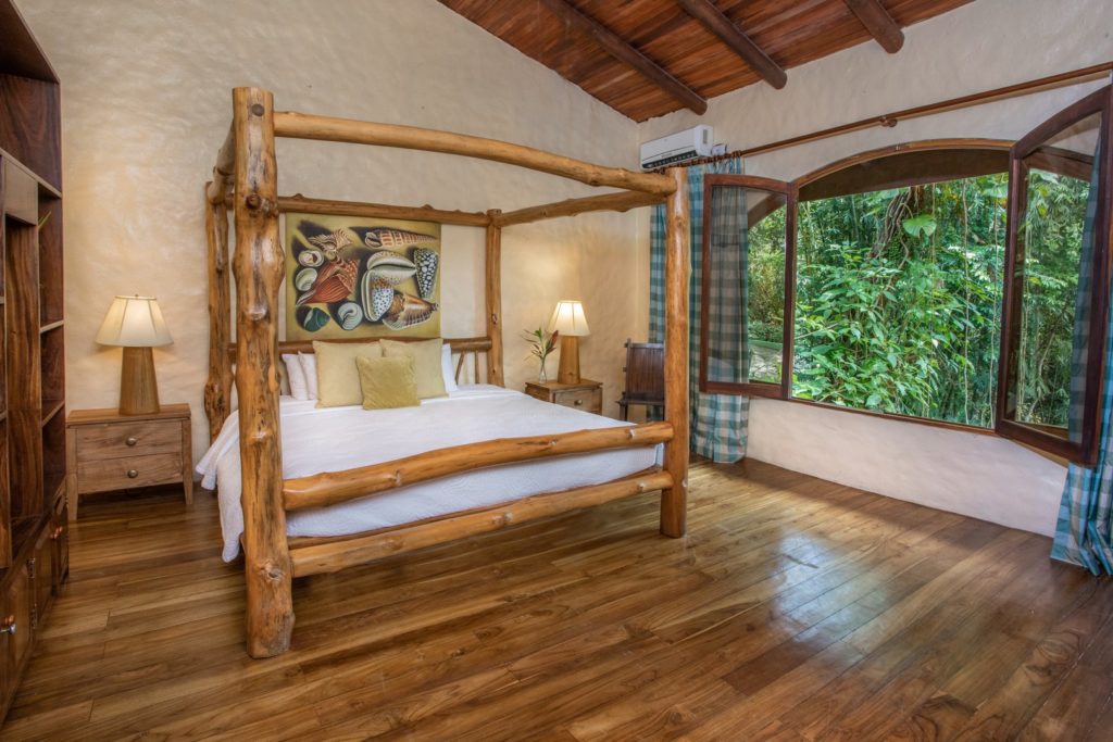This stunning king bed is crafted using locally-sourced natural tree trunks.