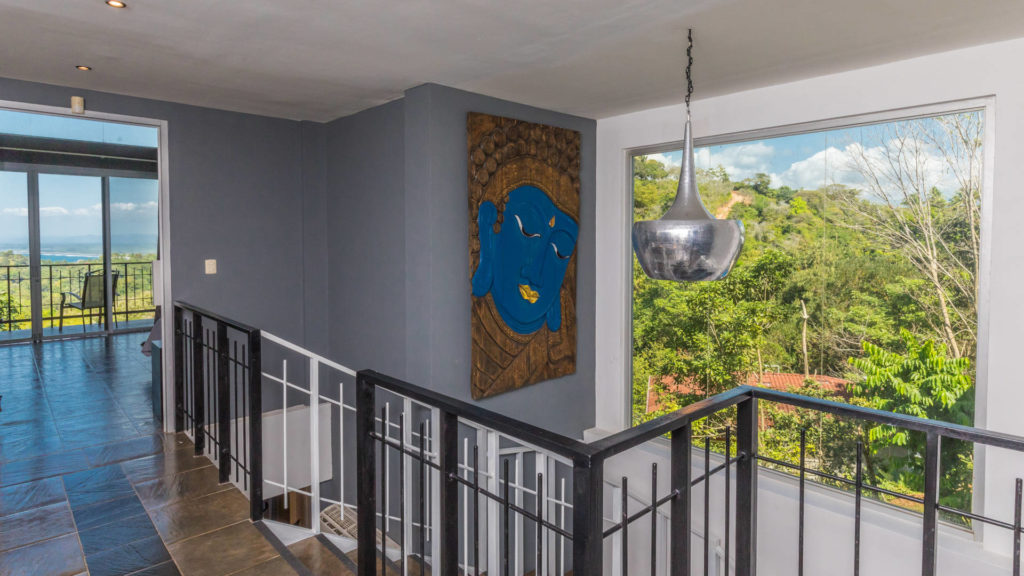 Beautiful art hangs over you as you walk downstairs gazing out over the rainforest.