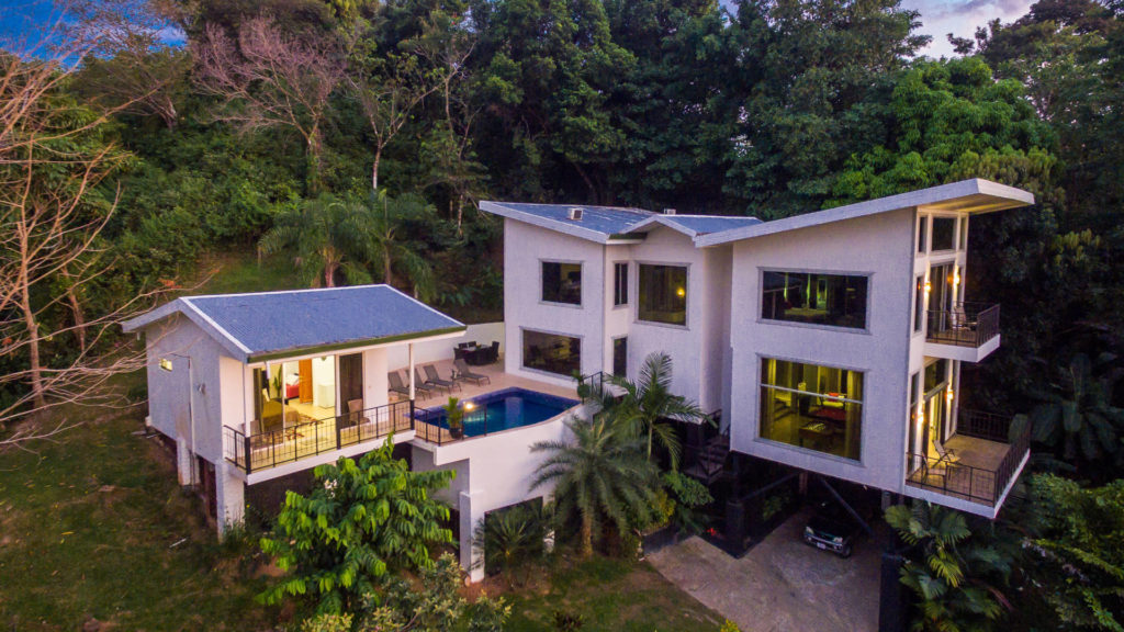 This beautiful home with its incredible architecture hangs out of the jungle and is the perfect villa for your vacation.